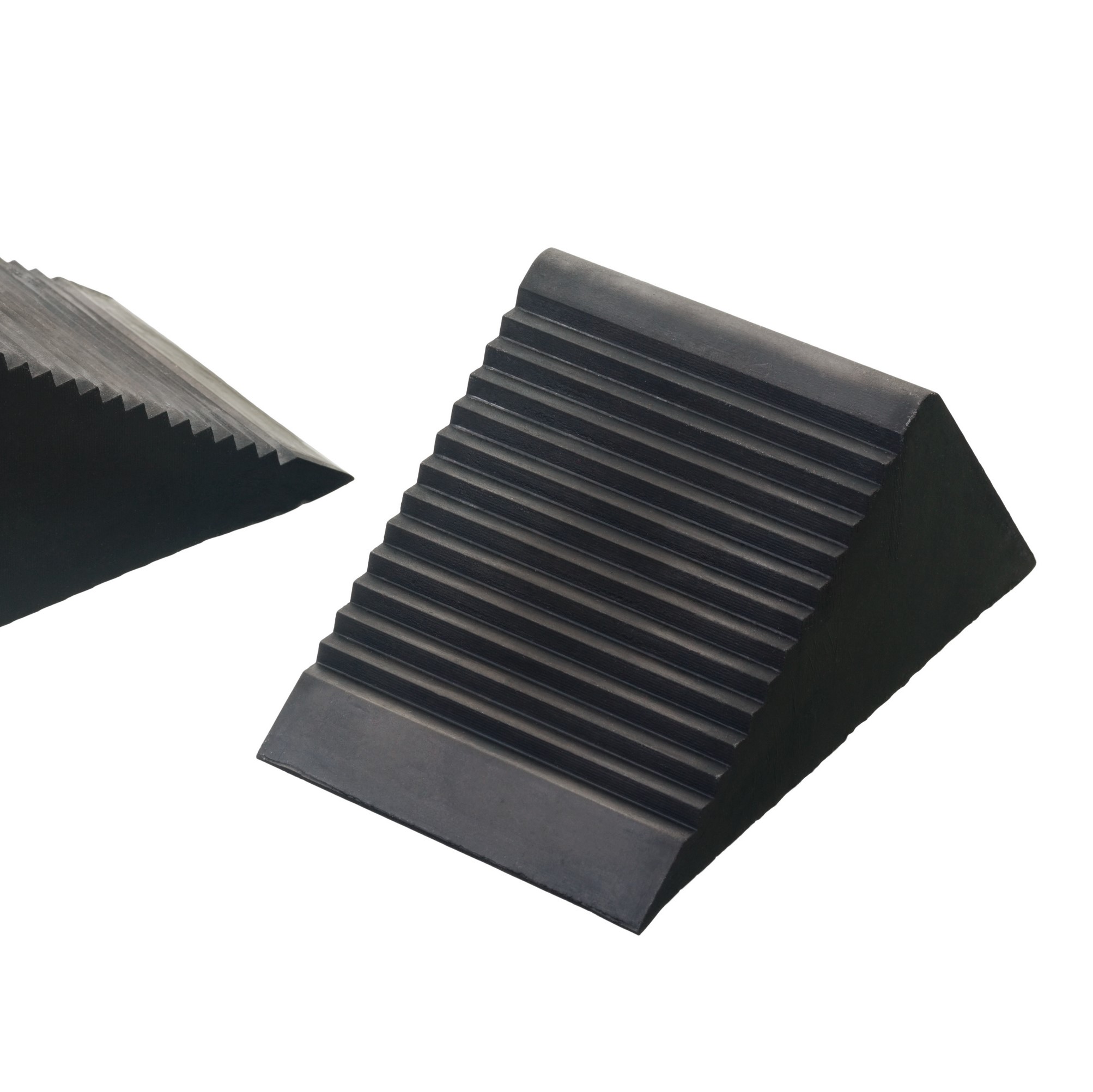Safety wheel chocks isolated on a white background. They are used for car rollback safety.