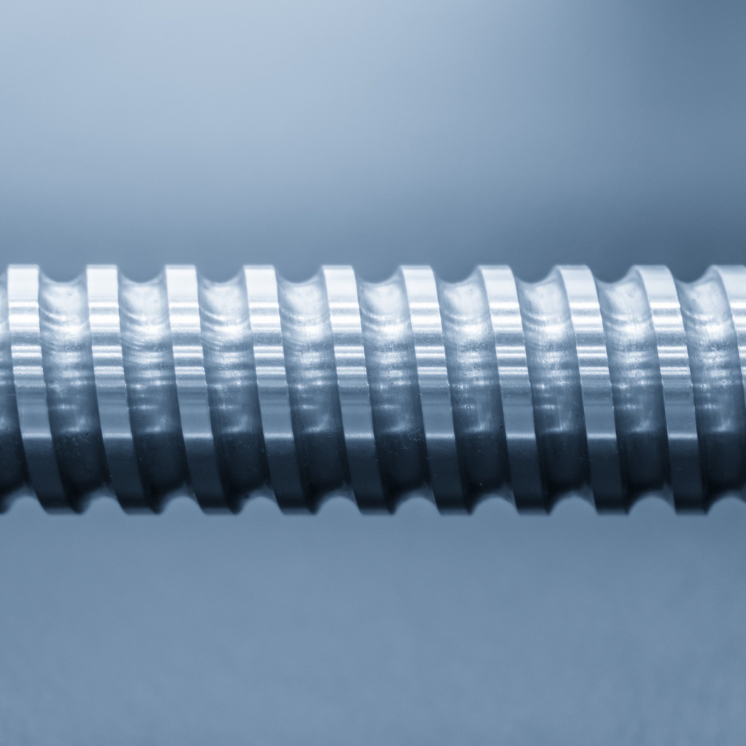 Close-up of the lead screw parts of the CNC machine. The hi-precision part of CNC machine manufacturing process.
