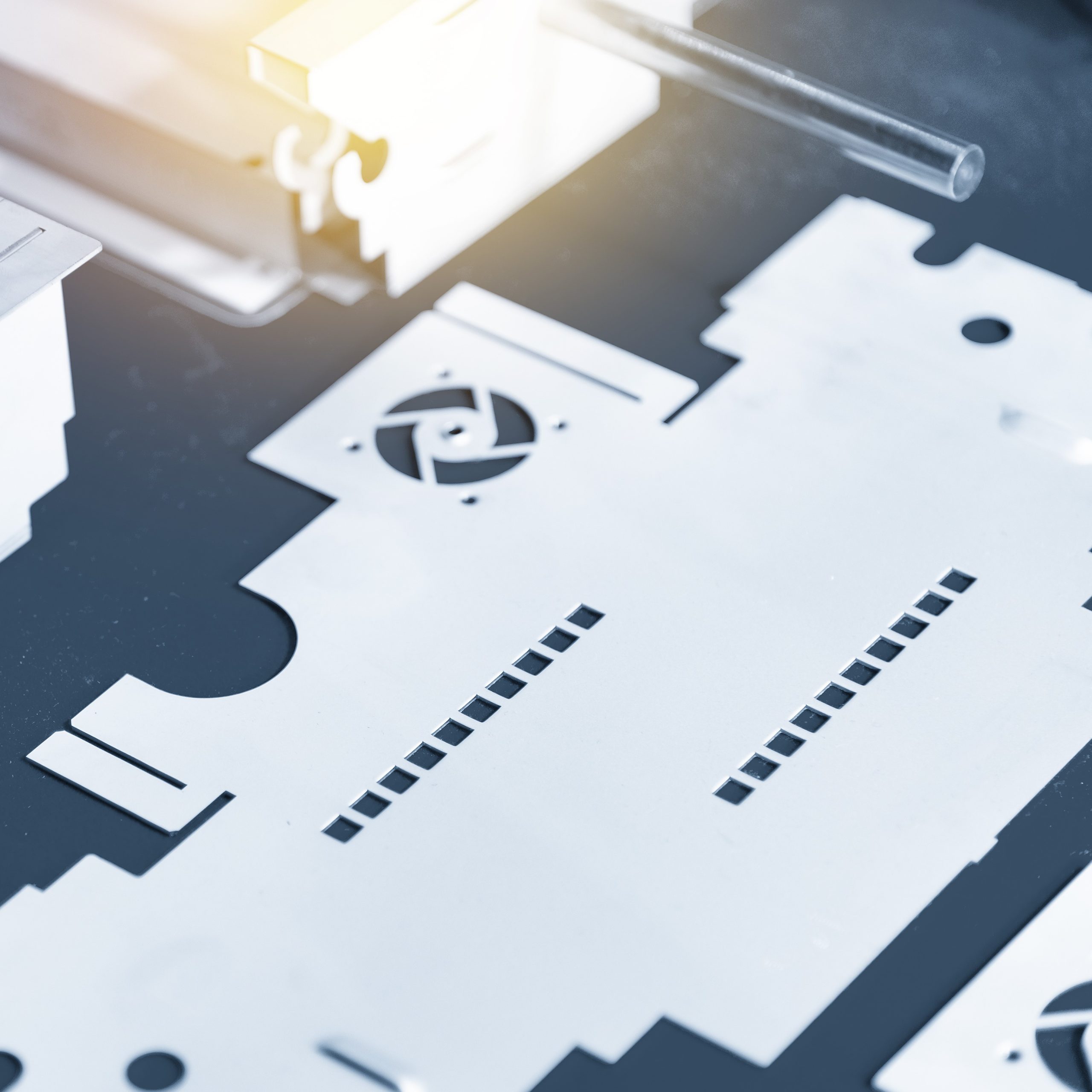 The sheet metal work pieces in the light blue scene. Sheet metal working manufacturing process.