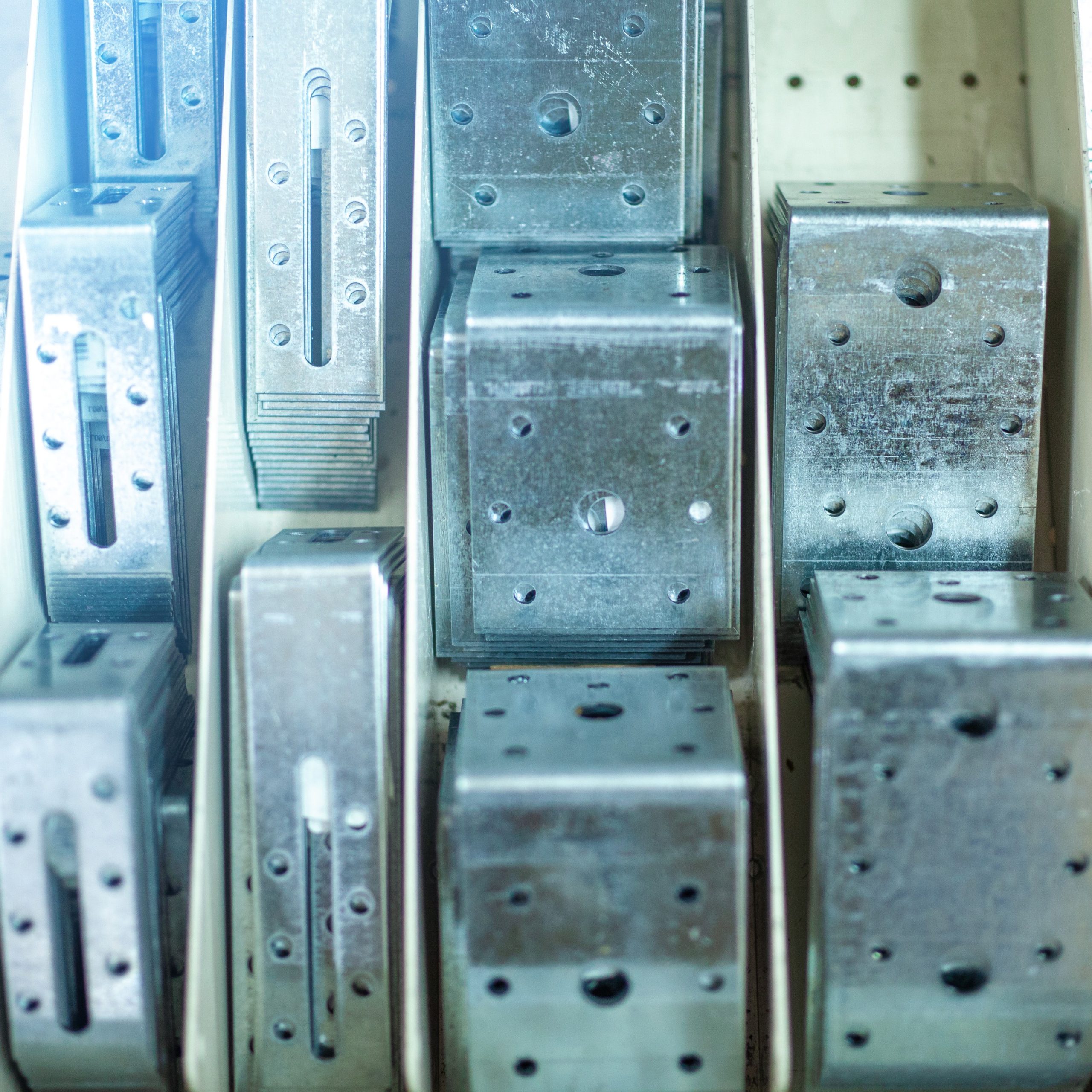 Steel zinc joining tie plates in hardware store shelf, different sizes